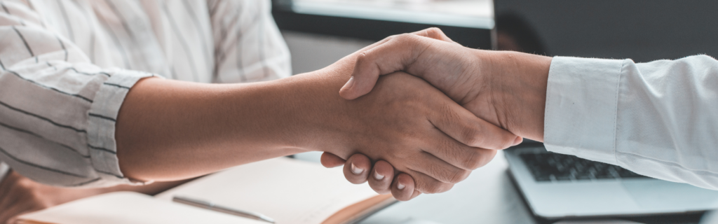 Two people shaking hands.